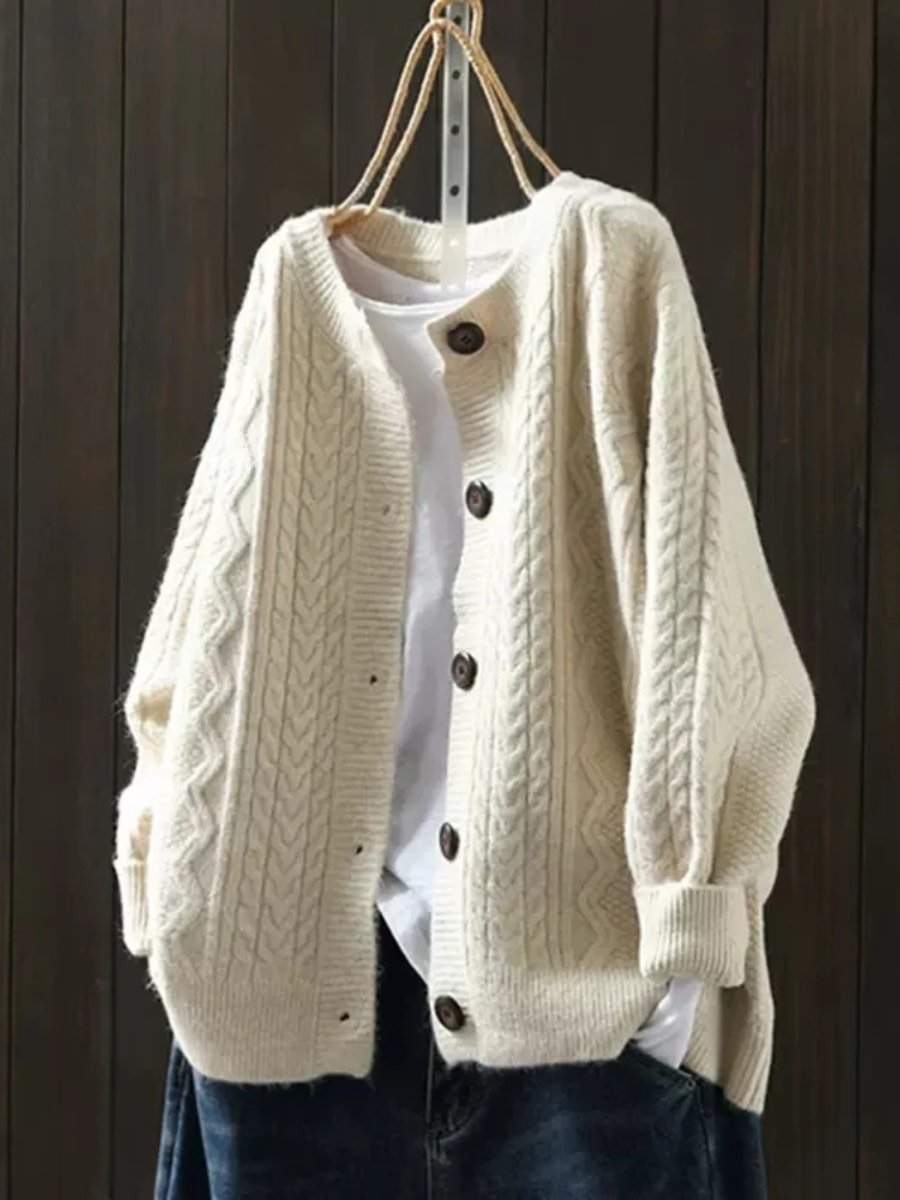Oversized cable knit cardigan sweater — front view on model