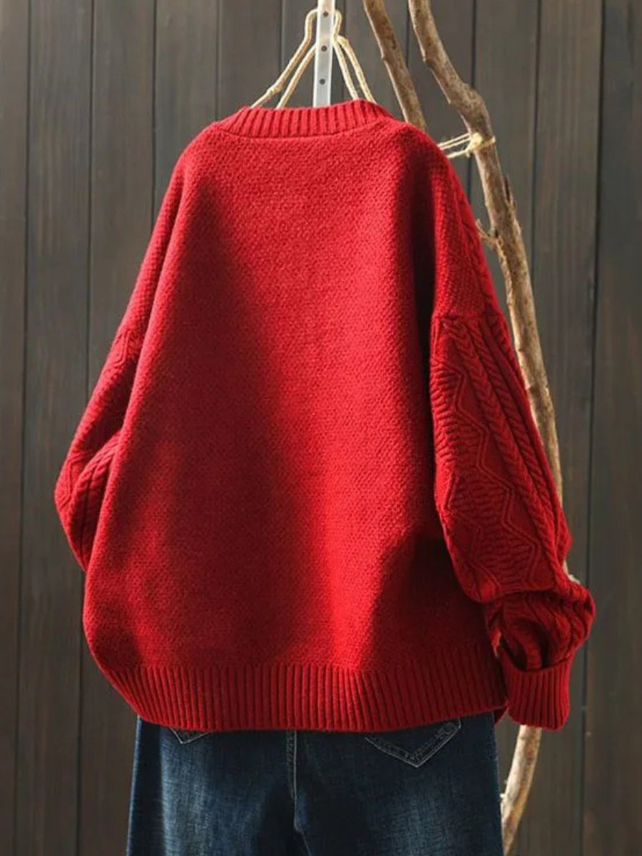 Oversized cable knit cardigan sweater — close-up of the fabric and stitching