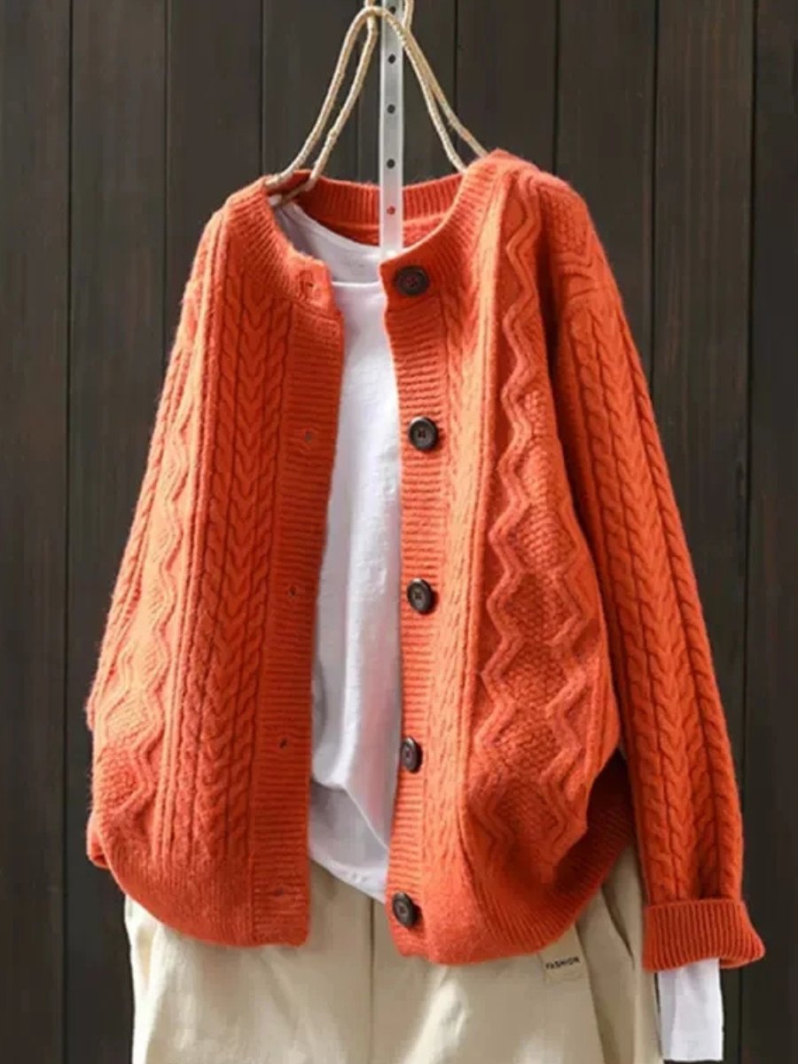 Oversized cable knit cardigan sweater — full-length view on model