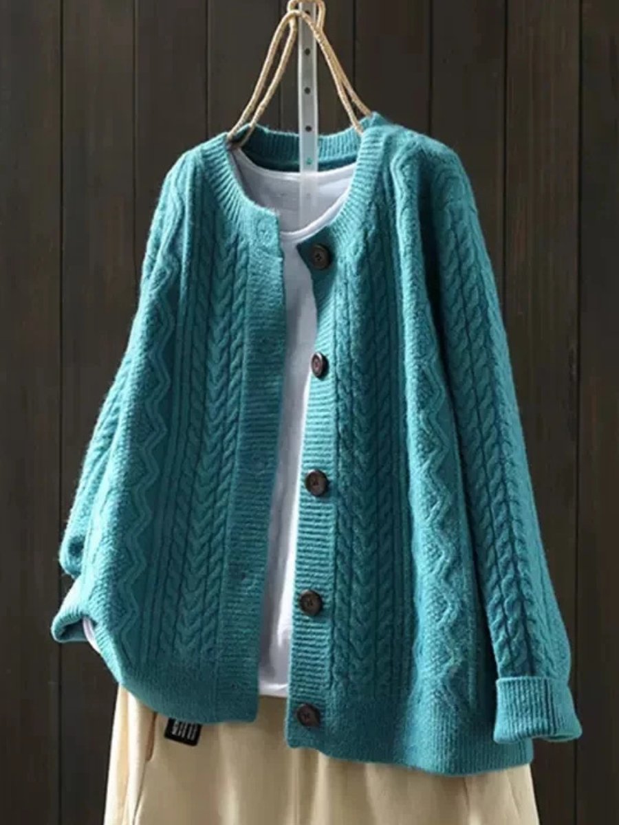 Oversized cable knit cardigan sweater — side view on model