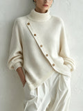 Oversized ivory turtleneck sweater for women, front view on model