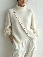 Oversized ivory turtleneck sweater for women, front view on model